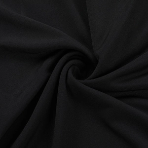 Close-up of black ribbed knit fabric showing fine texture and elastic material details