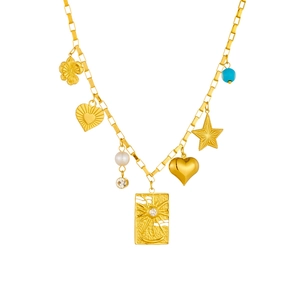 Golden stainless steel necklace with sun moon pendant and multi-charms on white background