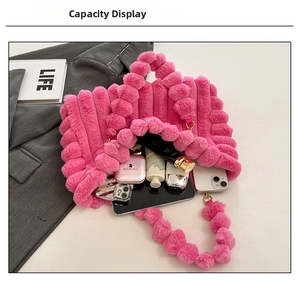 Hot pink plush faux fur tote bag showing interior capacity for tablet and cosmetics