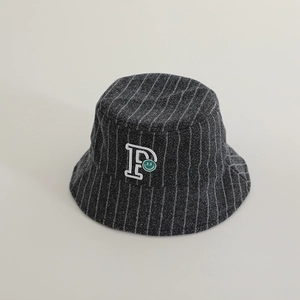 Detail of dark grey striped kids bucket hat with P letter and green smiley embroidery