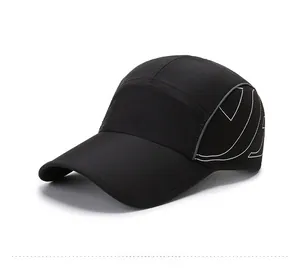 Detail view of the black quick-dry baseball cap featuring breathable side mesh panels