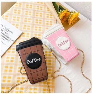 Detailed view of coffee cup shaped crossbody bags in pink and brown with gold chain