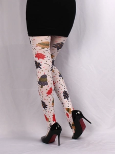Detail of white festive tights featuring colorful Christmas tree prints and dot patterns