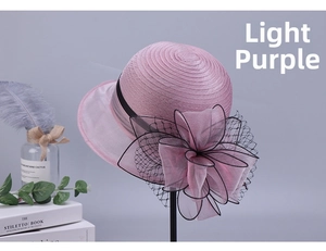 Detail of light purple organza sun hat with large floral decor and black mesh veil