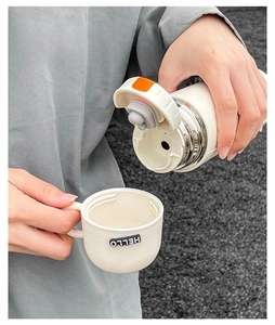 Detail of detachable lid used as a small cup for ivory white vacuum insulated flask