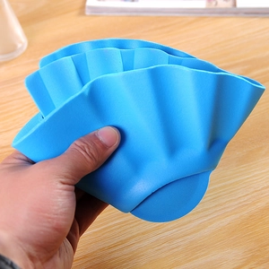 Adjustable royal blue silicone baby shower cap shown with flexible foldable texture
