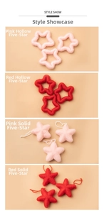 Close-up of pink and red felt star ornaments with solid and hollow textures