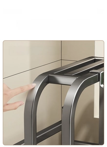 Detail of rounded metal edges and gunmetal gray finish on a kitchen knife holder