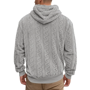 Close-up of gray men's hoodie featuring thick jacquard teddy fleece and cable knit texture