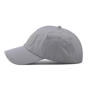 Detail of distressed grey washed cotton baseball cap with embroidered USA flag patch