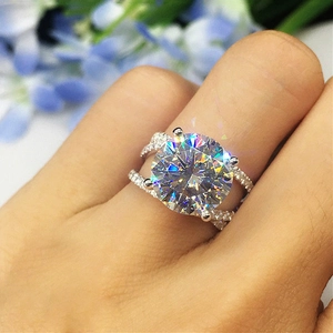 Elegant four-prong solitaire round zircon cross ring with shimmering accents for women