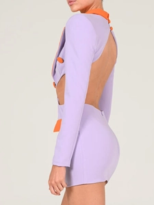 Detail of cut-out back design and purple-orange color block on a slim fit blazer dress