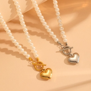 Stainless steel pearl necklaces with gold and silver heart pendants and T-bar clasps