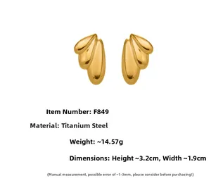 Polished titanium steel wing earrings in gold finish with F849 dimensions and weight info