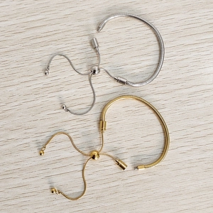 Adjustable stainless steel snake chain bracelets in gold and silver with spherical slide clasp