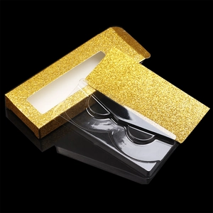 Close-up of golden glitter eyelash paper box with clear plastic inner tray
