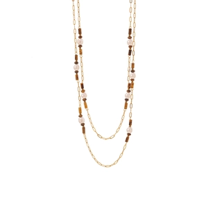 Double-layer gold necklace with brown tiger stone beads and white pearls on white background