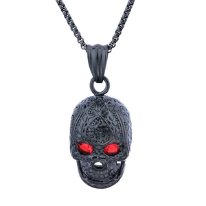 Gothic skull pendant with red gemstone eyes and mandala engravings on a black chain