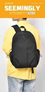 Minimalist black nylon backpack with drawstring side pockets and rope zipper pulls