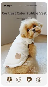 Detail of warm teddy vest showing seersucker fabric, bear patch and windproof drawstring
