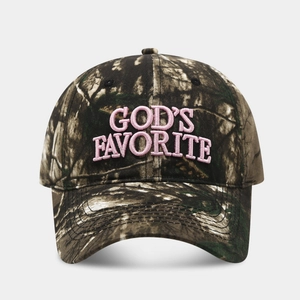Detail of pink 3D embroidery text reading GOD'S FAVORITE on a jungle camo baseball cap