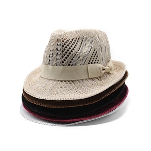 Detail of hollow knit straw jazz hats in five colors featuring elegant bow ribbons