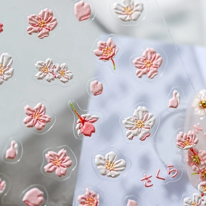 Self-adhesive 5D embossed cherry blossom nail stickers with floral patterns and petals