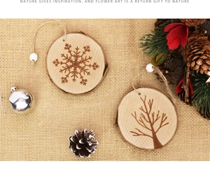 Detail of wooden Christmas ornaments with snowflake patterns on jute fabric background