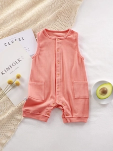 Pink ribbed sleeveless baby bodysuit with buttons and pockets on neutral background