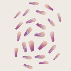 Detail of long coffin press-on nails with purple gradient, rhinestones and silver lace patterns