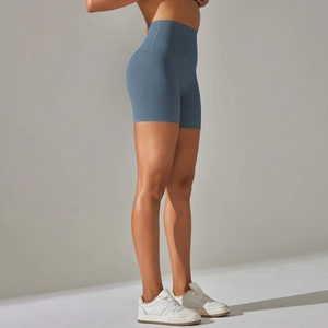 Detailed side view of high-waist fitness shorts in misty blue with seamless peach lift effect