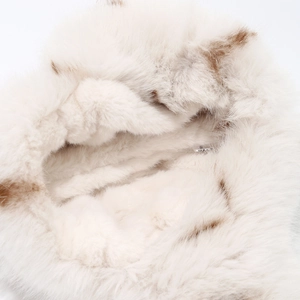Detailed macro view of soft faux fur lining and fabric label inside the winter trapper hat