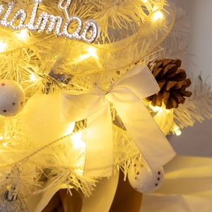 Detailed close-up of 55cm mini white Christmas tree with silver balls and warm lights
