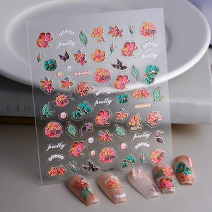 Detail view of Co-055 3D embossed floral nail stickers with gold outlines and pearl accents