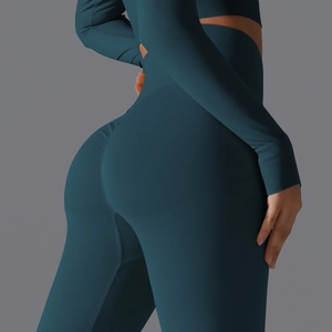 Close-up of seamless dark green high waist yoga leggings with scrunch butt lifting detail