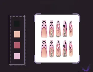 Detail of Halloween coffin press-on nails with pink flame, moon patterns and rhinestones