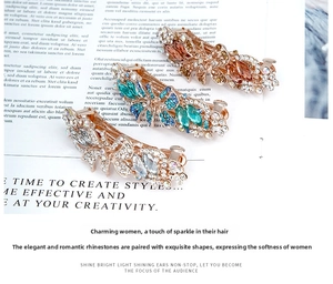 Detailed macro view of layered crystal floral spring hair clips with rhinestone accents