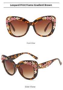 Detail of cat-eye leopard frame sunglasses with 3D pink flowers and gold leaves