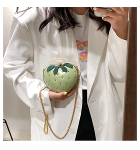 Mini strawberry shaped crossbody bag in light green with leaf detail and gold chain