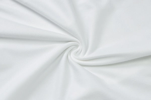 Close-up macro view of high-quality white cotton fabric texture and soft drapes on dress