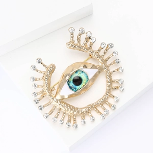 Elegant gold eye brooch with blue gradient center and sparkling rhinestones for women