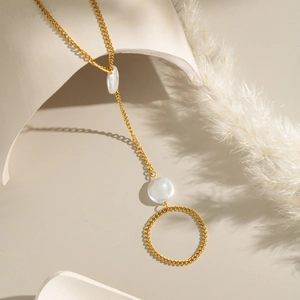 Elegant 18K gold plated stainless steel pearl finger chain ring with a circular pendant