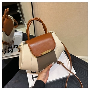 Close-up of contrast-color PU leather handbag with metallic lock and branded text detail