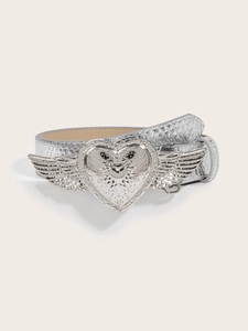 Detail of silver heart with wings embossed buckle on a metallic faux leather belt