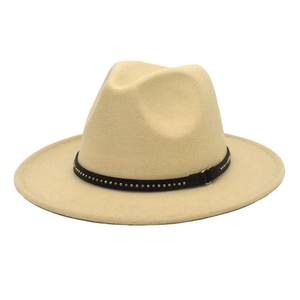 Detail of light beige wool fedora featuring a black band with decorative metal studs