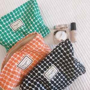 Three minimalist polka dot cotton cosmetic bags with Time To Party labels in multiple colors