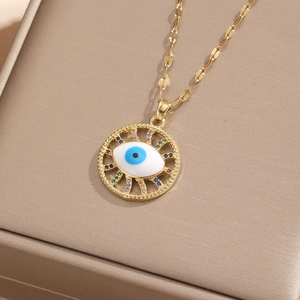 Detailed view of the gold Evil Eye pendant with colorful zircon stones and fine chain