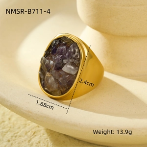 Detail view of a gold geometric stainless steel ring featuring irregular amethyst stone