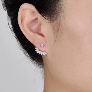 Elegant 925 sterling silver stud earrings with round and marquise cubic zirconia on ear