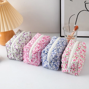 Floral quilted cotton makeup bags set in purple, red, blue, and pink floral patterns
